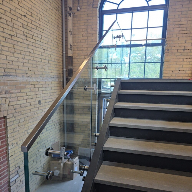 Elegant staircase with custom glass railing