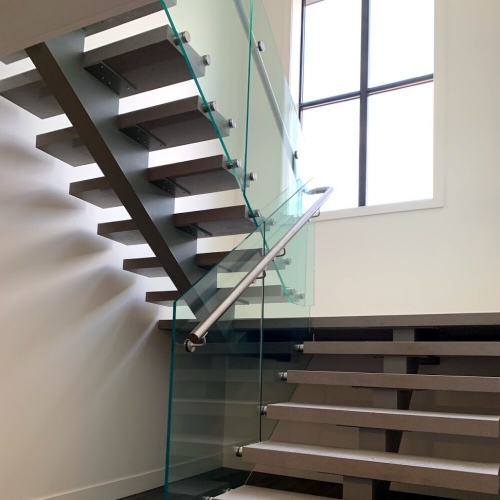 Safety-First: Infusing Stability Into Metal Staircases With Glass Railings